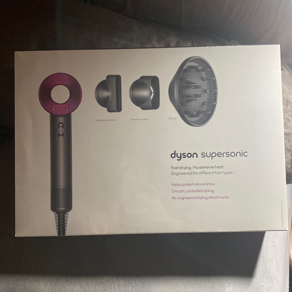 Dyson supersonic with accessories. Never opened.
